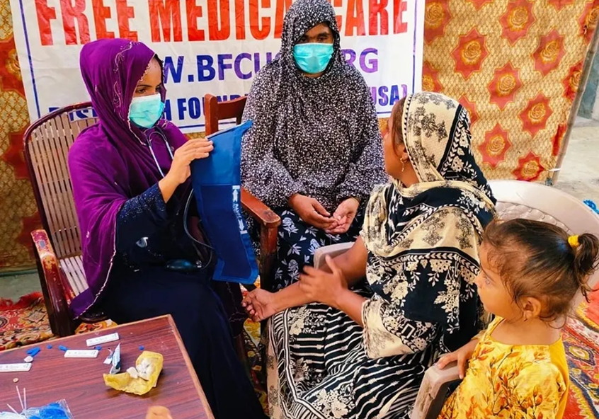Women receiving medical care at a clinic.